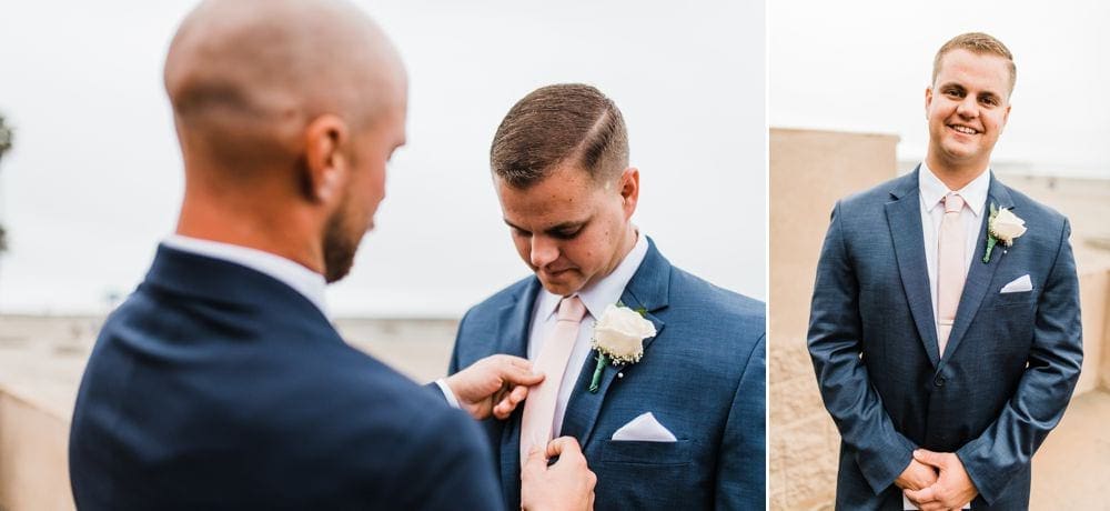 Best man fixing the groom's tie