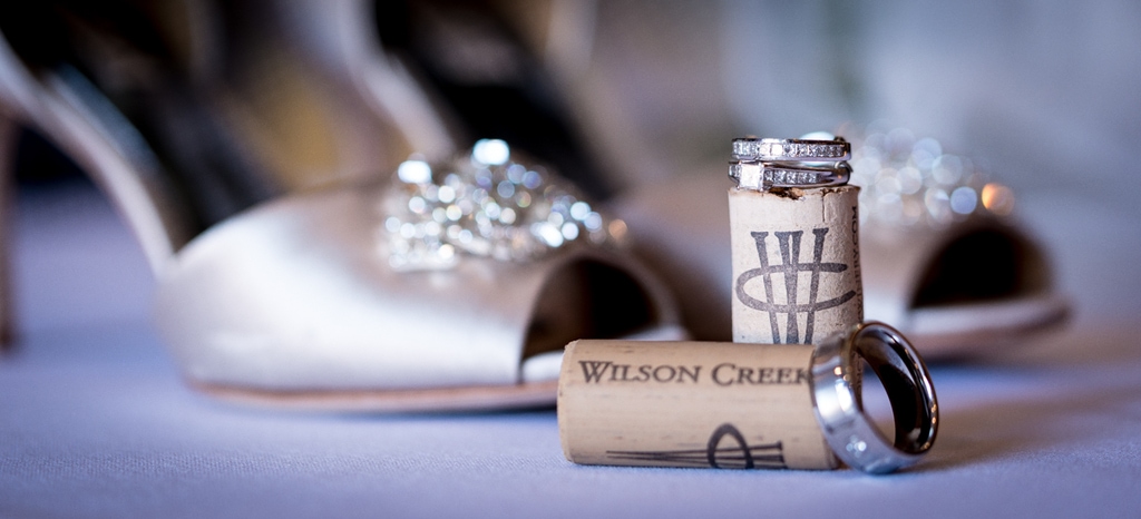 Bride's shoes and ring with wine cork at Wilson Creek Winery wedding in Temecula. 