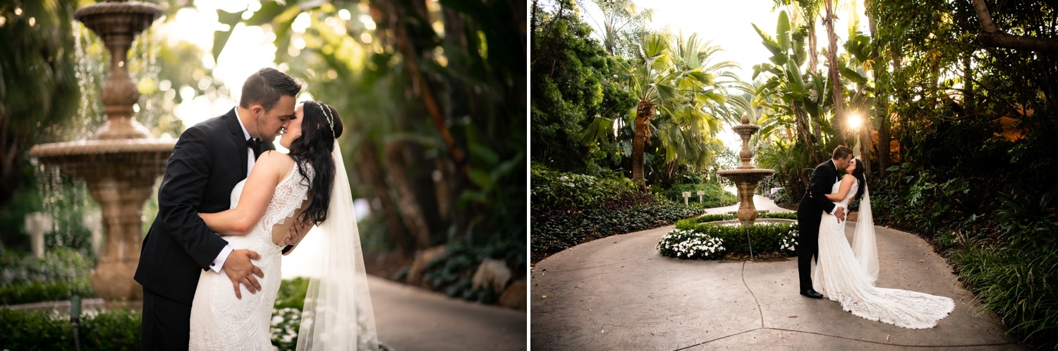 Couple kissing at their wedding by the water fountain. 
