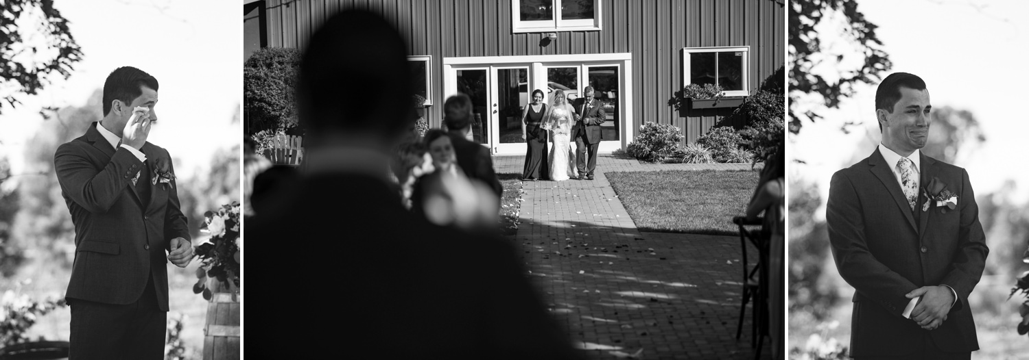 Groom seeing his bride walk down the aisle at their wedding. 