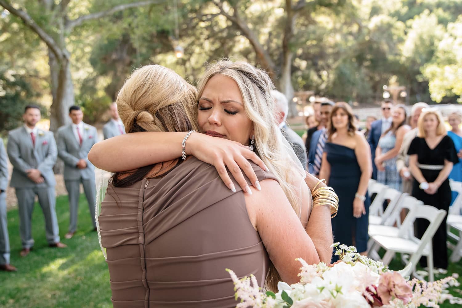 Bride hugging mother at Stone House Ceremony in Temecula, CA